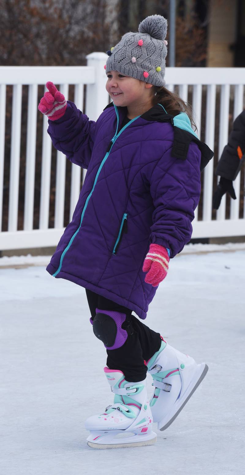 Rosie Rodriquez, 7, of Villa Park skates on the Polar Plaza synthetic ice during Frozen Fest in Glen Ellyn Saturday.