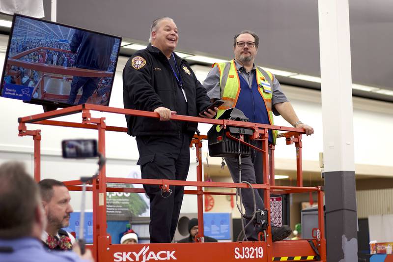 Joliet Police Chief William Evans stands with Troy DePeder, one Walmart's team leaders, during the 36th annual Santa's Cops event on Saturday, Dec. 6, 2025, at Walmart, 401 Illinois Route 59, in  Shorewood.