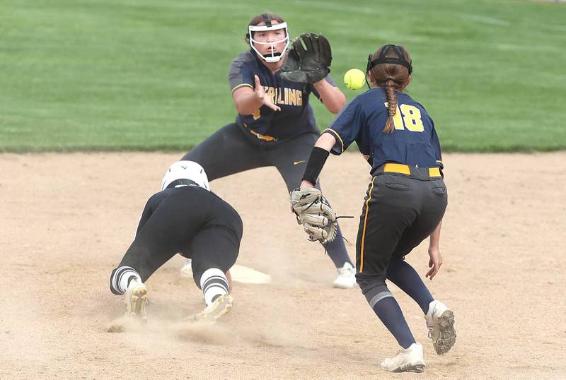 Kaneland's Emily Olp gets back just in time as Sterling's Katie Taylor flips the ball to Carly Sullivan Tuesday, May 31, 2022, during their Class 3A Sectional semifinal game at Sycamore High School.