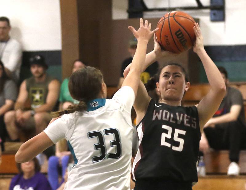 Prairie Ridge's Addie Meyer shoots the ball over Woodstock North's Adelynn Saunders during the girl’s game of McHenry County Area All-Star Basketball Extravaganza on Sunday, April 14, 2024, at Alden-Hebron’s Tigard Gymnasium in Hebron.