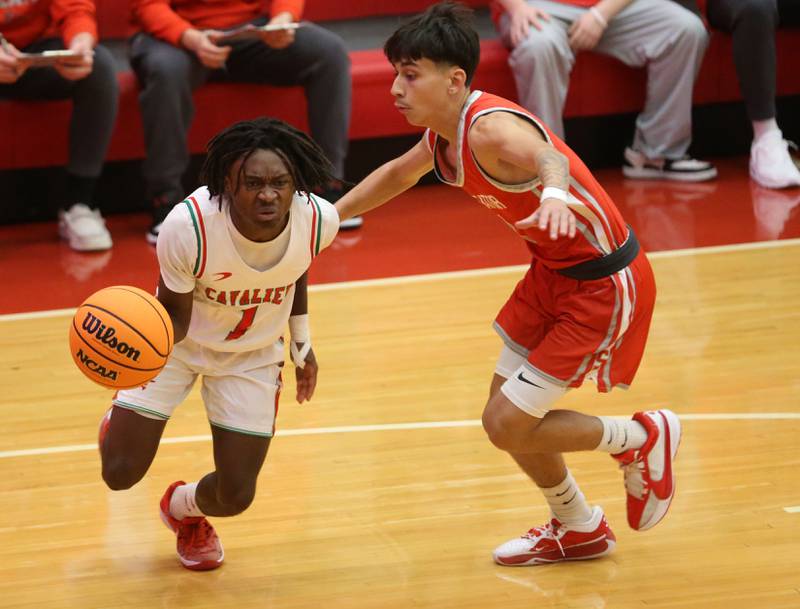L-P's Cordell Wheatley dribbles around Streator's Adrian Phalen during the Dean Riley Shootin' The Rock Thanksgiving Tournament on Monday, Nov. 25, 2024 in Kingman Gym at Ottawa High School.