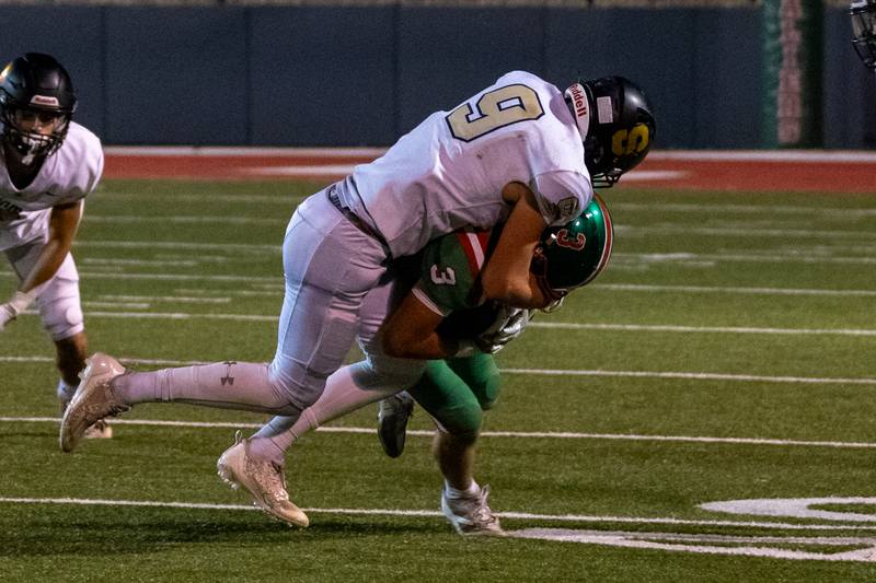 Michael Hartman of L-P gets tackled by Caden Odonnell of Sycamore on Friday, October 11, 2024 at Howard Fellows Stadium in LaSalle.