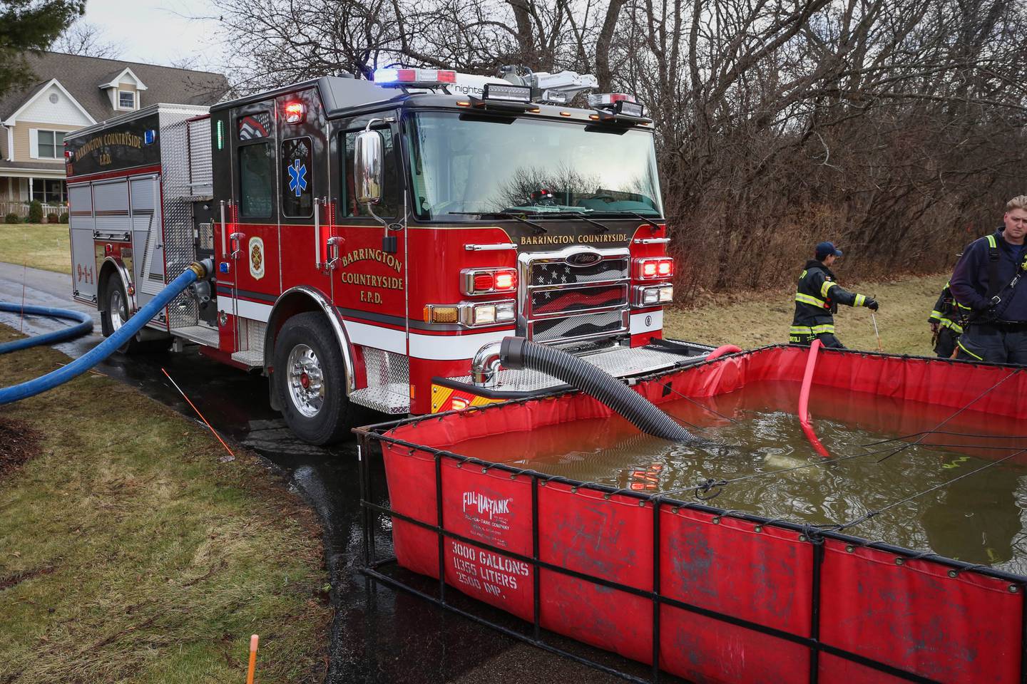 FIrefighters with the Barrington Countryside Fire Protection District work to put out a barn fire in Barrington Hills on Saturday afternoon, Dec. 31, 2022.