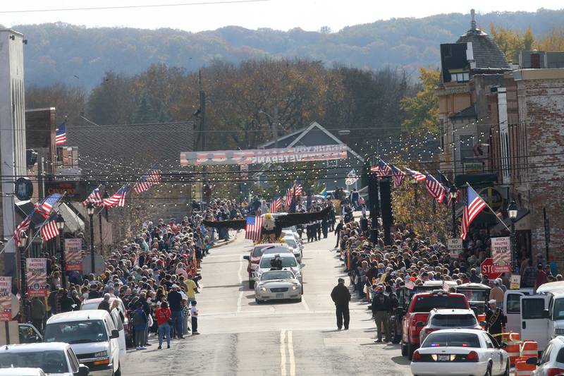 A large crowd watches the 16th annual Utica Veterans Parade and Air Show on Sunday Nov. 5, 2023 downtown Utica.