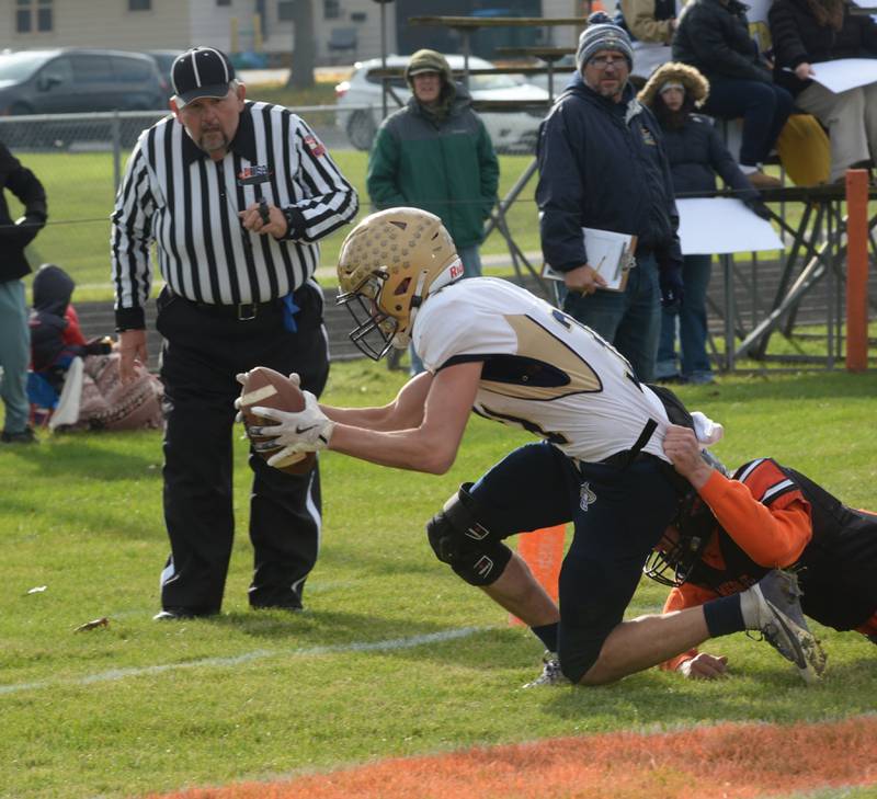 Polo's Noah Dewey (31) reaches for the goal line during 8-man playoff action against Milledgeville on Saturday, Nov. 16, 2024 at Milledgeville.