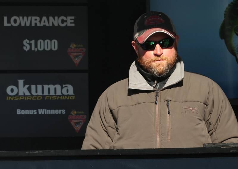 Michael Martin of Serena, weighs his fish during the National Walleye Tour Masters Walley Circuit on Saturday, March 23, 2024 in Spring Valley.
