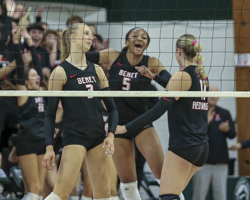 Benet celebrates a kill by Molly Welge (3)during Class 4A Glenbard West Sectional final volleyball match between St Charles North at Benet. Nov 6, 2025 in Glen Ellyn.