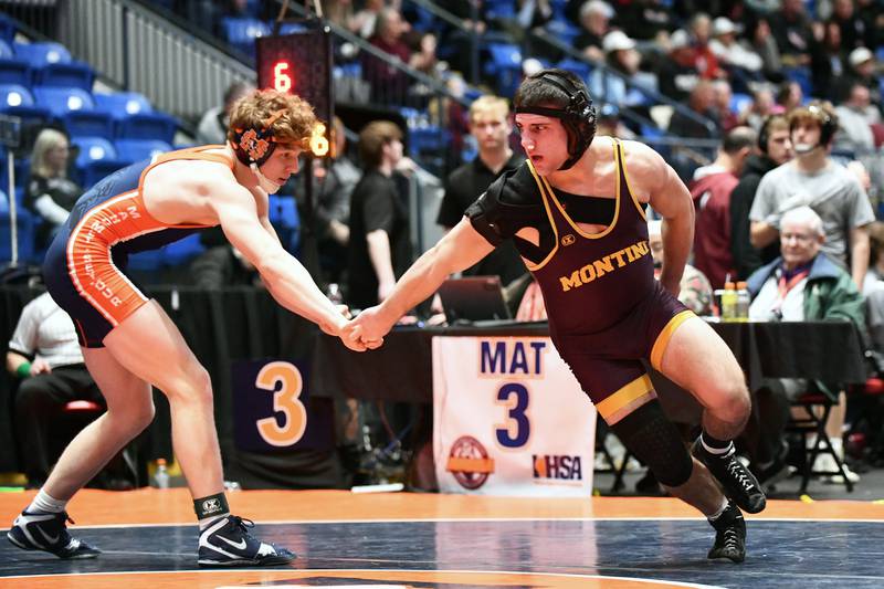 Santino Tenuta of Montini evades Alexander Demos Mahomet-Seymour in the 165-pound match during the IHSA Dual Team State Finals in Bloomington on Saturday, March 1.