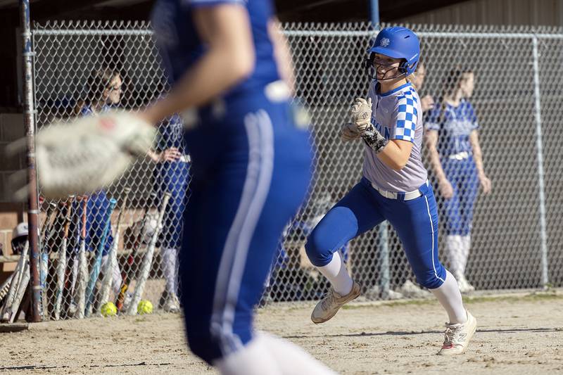 Newman’s Jess Johns rounds third base to score against Princeton Monday, April 29, 2024.