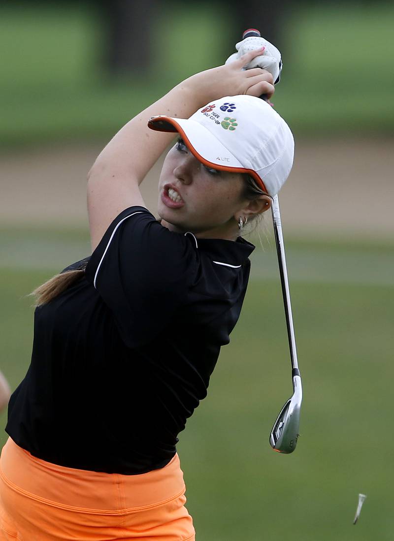 Crystal Lake Co-op’s Delaney Medlyn watches her tee shot the 16th hole during the Fox Valley Conference Girls Golf Tournament Wednesday, Sept. 20, 2023, at Crystal Woods Golf Club in Woodstock.
