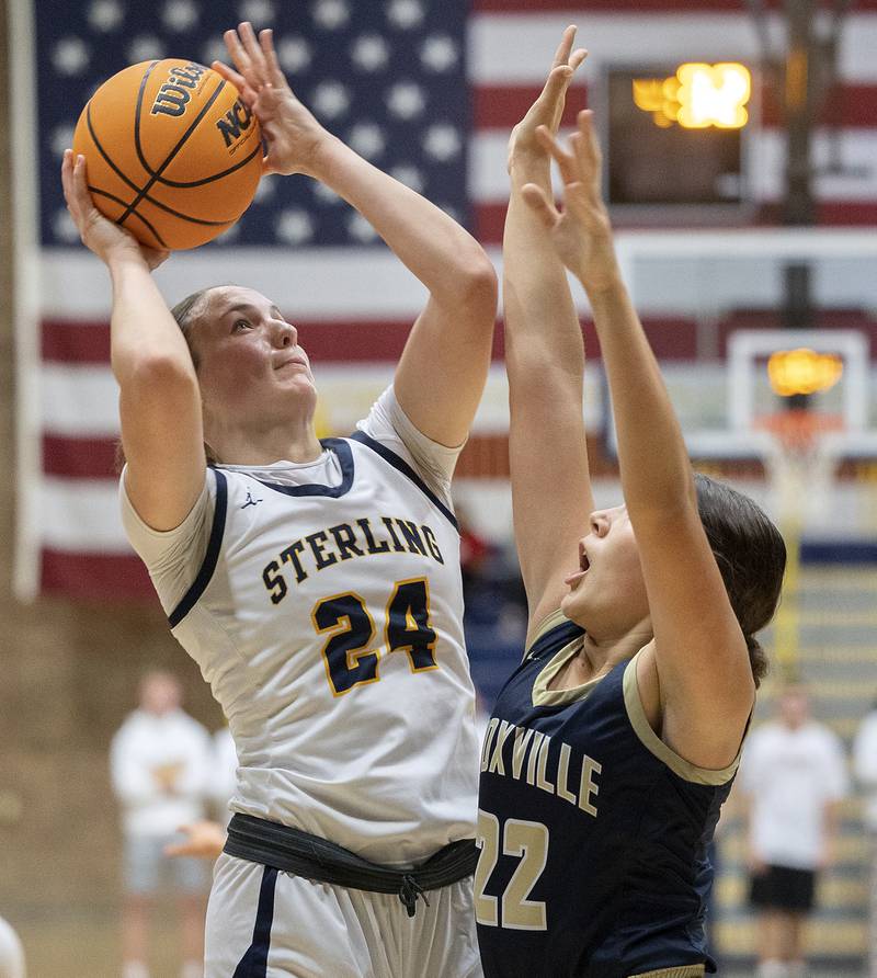 Sterling’s Madison Austin puts up a shot against Knoxville’s Madison Hilgenberg Tuesday, Nov. 19, 2024, at Sterling High School.