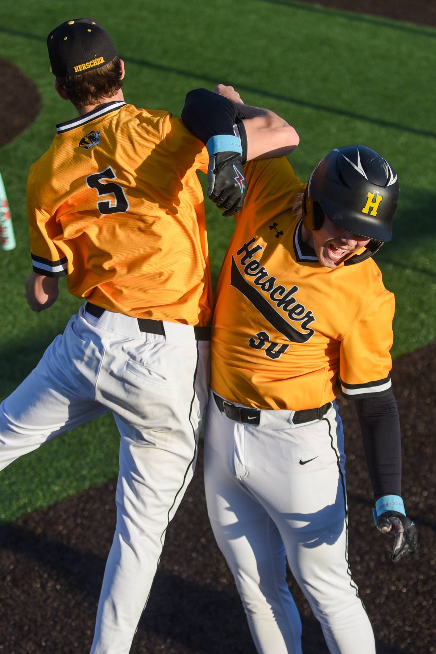 Herscher's Colton Carson, right, is congratulated by Tanner Jones after hitting a home run in a home game against Coal City Monday, April 20, 2026.