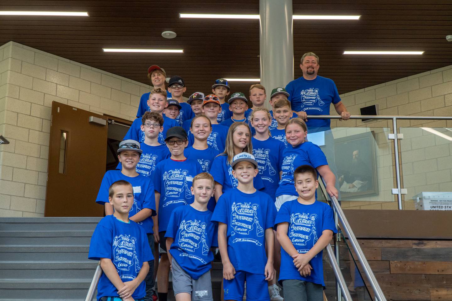 Carus Summer Science Camp graduates pose with Camp Director Dan Fitzpatrick.