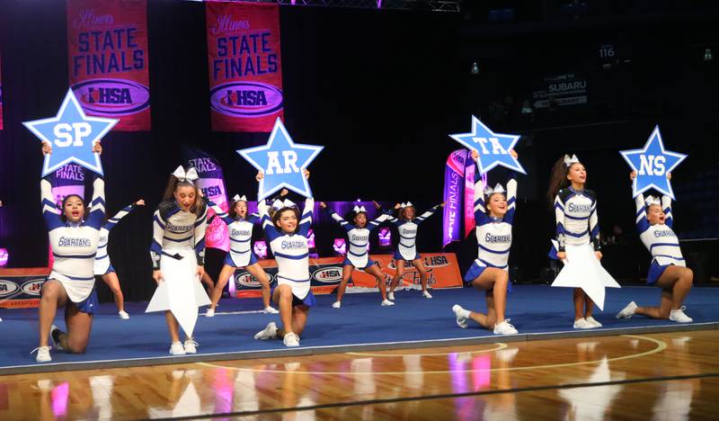 Members of the Wheaton St. Francis cheerleading team perform at the Competitive Cheerleading State Final Competition on Saturday, Feb. 3, 2024 at Grossinger Motors Arena in Bloomington.