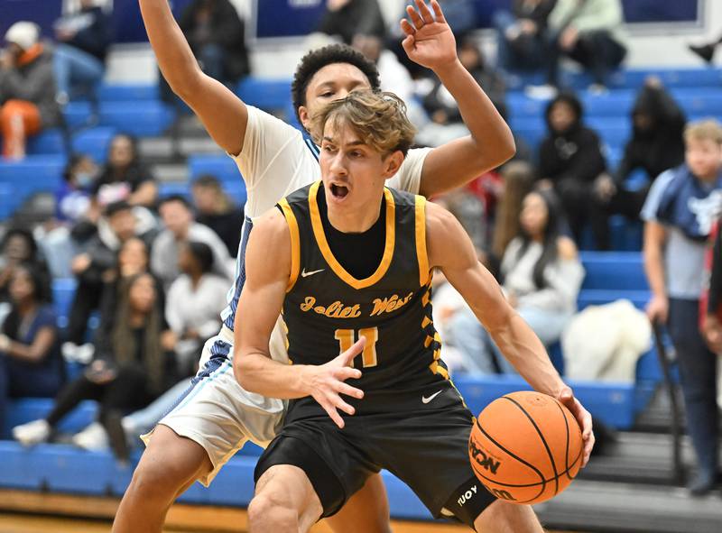 Joliet West's Luke Grevengoed drives to the basket during the conference game against Plainfield South on Friday, DEC. 05, 2025, at Plainfield.
