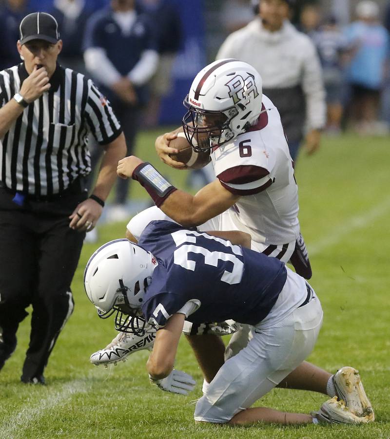 Prairie Ridge's Luke Vanderwiel is tackled by Cary-Grove's Matthew Maka during a Fox Valley Conference football game on Friday, Aug. 29, 2025, at Cary-Grove High School in Cary.