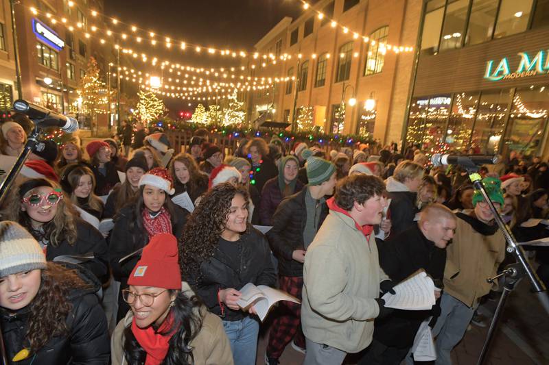 St. Charles North and East High School Choirs sing carols during the Lighting of the Lights Ceremony at 1st Street Plaza on Friday, Nov 28, 2025 in St. Charles.