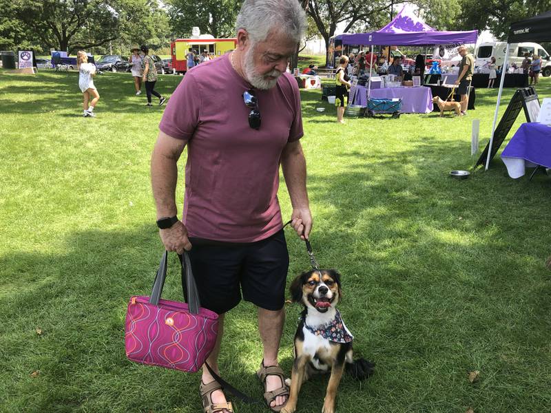 Rick Kelly and his dog Scooter enjoy Pawfest in Huntley Aug. 3, 2024.