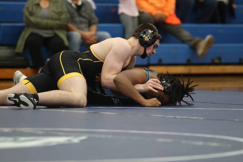 Joliet West’s Jacob Tyderek gets two points against Plainfield South’s Jamal Jones Jr. in the 215-pound match on Wednesday, Dec. 11, 2024 in Plainfield.