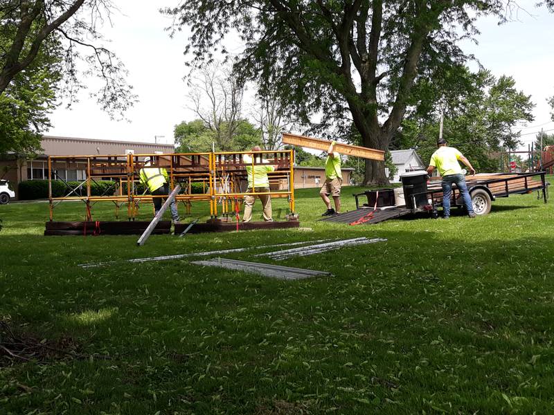 Crews construct a stage Wednesday, June 1, 2022, ahead of the Music and Art Festival planned for Pulaski Park, Friday and Saturday, June 3 and 4.