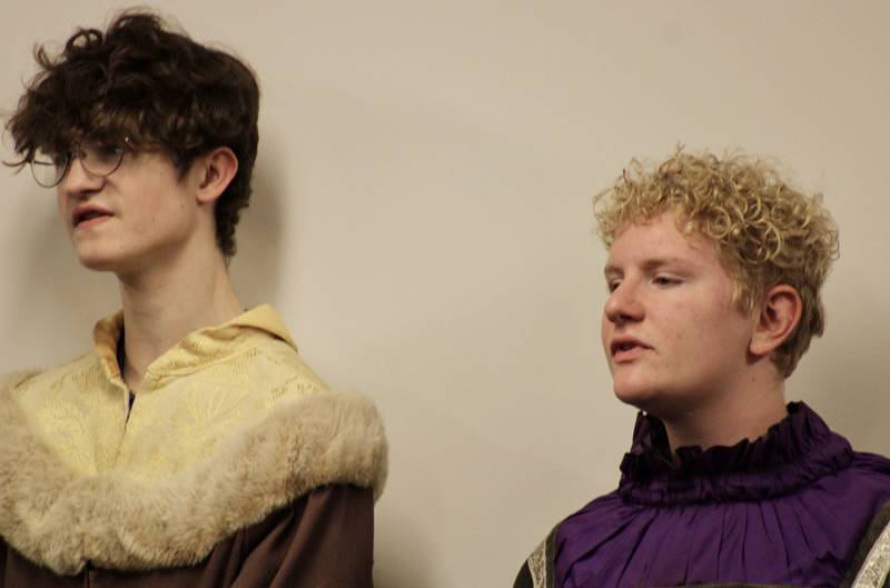 Clark Bonnewell and Dominik Zachary sing with the Dixon High School choral group during a preview of its madrigal dinner performance, which will be 6:30 p.m. Friday at the Dixon High School cafeteria.