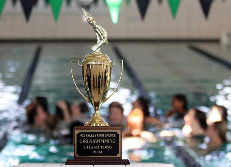 Swimmers from Dundee-Crown co-op take a celebratory swim   after the Fox Valley Conference Championship Meet at Woodstock North High School on Saturday, Nov. 2, 2024 in Woodstock .