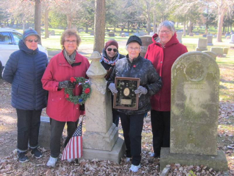 On Veterans Day Chief Senachwine DAR Chapter members Williamson, Bittner, Gillfillan, Finfgeld, and Byrd gather near the marker for Lt. Peter Wykoff to honor his service in the Civil War.  Ms. Finfgeld holds a framed photo of Lt. Wykoff with his uniform belt buckle and buttons, borrowed from the Marshall County Historical Society Museum.