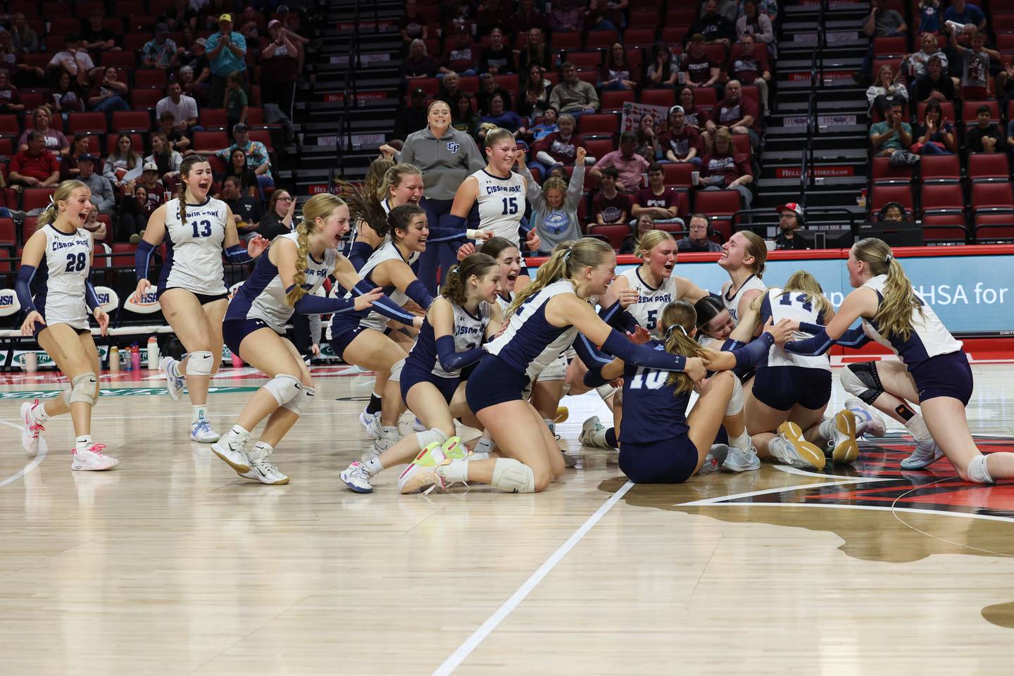 Cissna Park players rush the floor as the Timberwolves secured a victory in two sets, 25-11, 25-14, over Stockton in the IHSA Class 1A State championship on Saturday, Nov. 15, 2025.