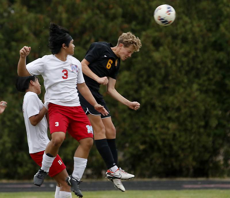 Richmond-Burton's Brayden Mumbower (right) heads th ball into the goal as Marian Central's Christopher John Fragante defends during the IHSA Class 1A Marian Central Regional Boys Soccer Final match on Tuesday, Oct. 22, 2024, at Marian Central High School in Woodstock.