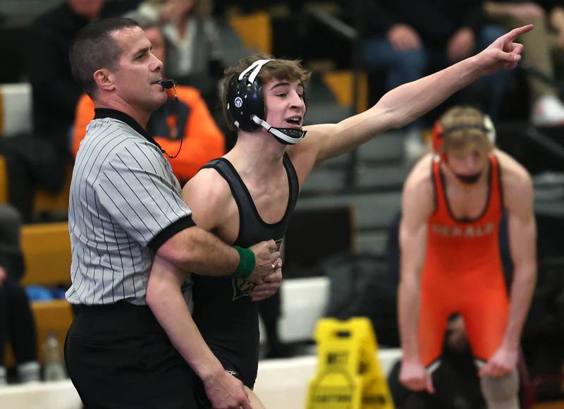 Sycamore’s Michael Olson reacts after his win over DeKalb’s Sam Howard at 120 pounds Friday, Jan. 16, 2026, at Sycamore High School.