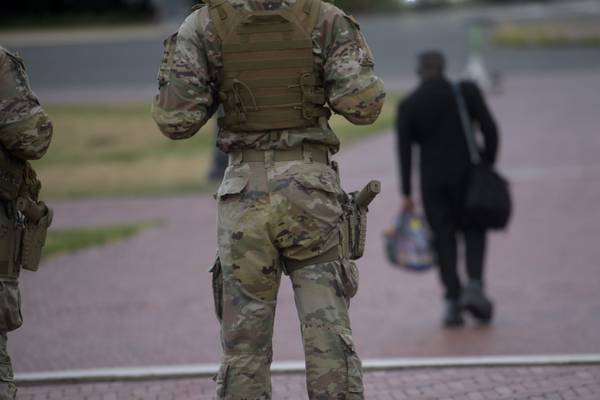 Some National Guard units in Washington are now carrying firearms in escalation of Trump deployment