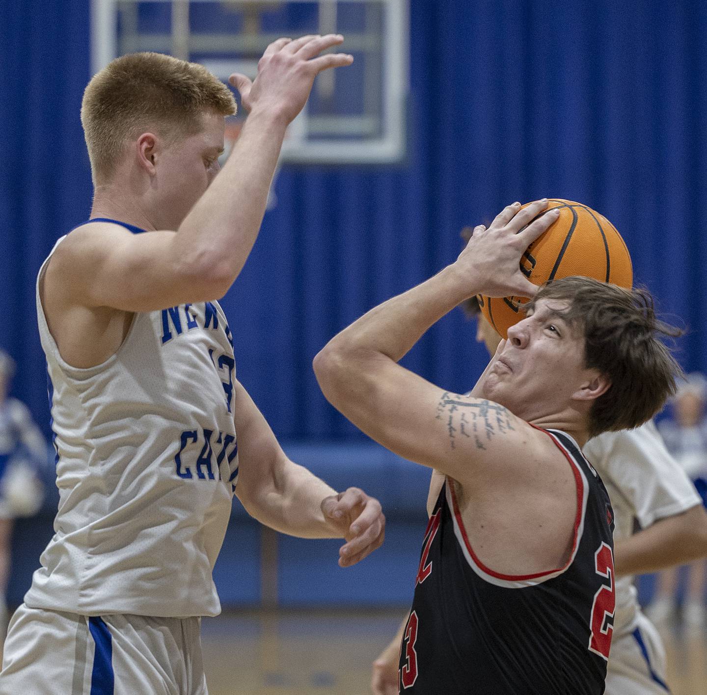 Hall’s Aiden Redcliff looks to put up a shot against Newman’s George Jungerman Friday, Jan. 17, 2025 at Newman High School.