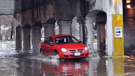Heavy rains flood Chicago roads and force NASCAR to cut short a downtown street race