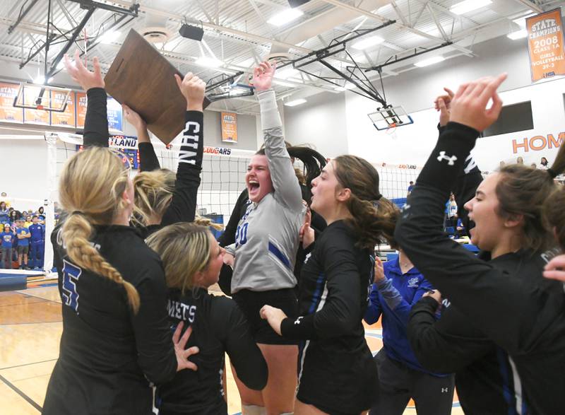 Newman players react after winning the Eastland Supersectional in Lanark on Friday, Nov.4. Newman won the match to advance to the state finals next week.