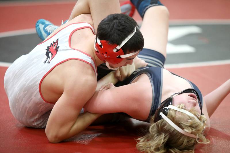 Yorkville’s Max Delgado (left) faces Oswego East’s Collin Speice in the 157-pound weight class during a dual meet on Thursday, Jan. 9, 2025 in Yorkville.