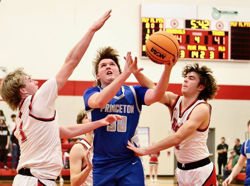 Princeton's Jordan Reinhardt drives against Hall at the Colmone Classic on Friday night.