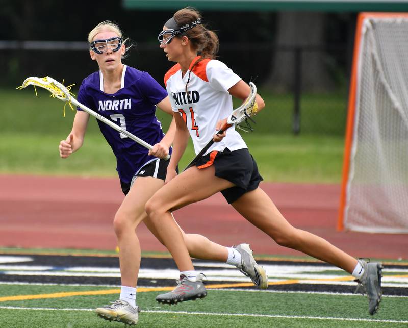 Crystal Lake’s Addie Bechler (right) races with the ball as Downers Grove North’s Barbara Schuessler defends during the Benet Supersectional game on June 3, 2025 at College of DuPage in Glen Ellyn.
