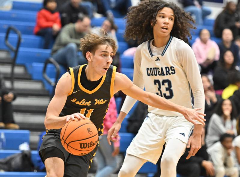 Joliet West's Luke Grevengoed drives to the basket during the conference game against Plainfield South on Friday, DEC. 05, 2025, at Plainfield.