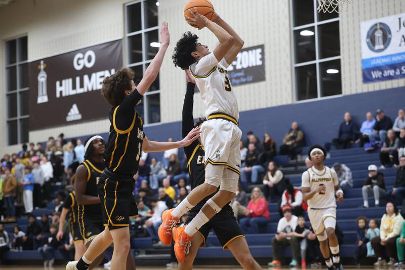 Joliet Catholic’s Danny Cervantes goes in for the basket against Elmwood Park in the Class 3A Joliet Catholic Regional semifinal game on Wednesday, Feb. 25, 2026 in Joliet.