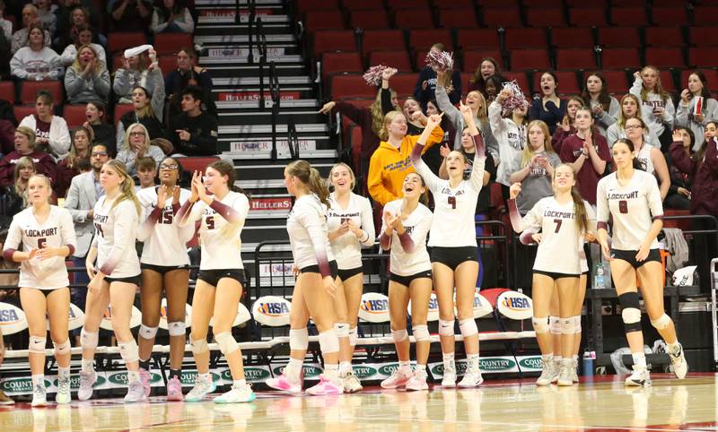 Members of the Lockport volleyball team react after getting a point against Marist during the Class 4A State semifinal game on Friday, Nov. 15, 2024 at CEFCU Arena in Normal.