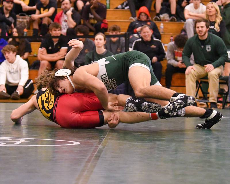 Elliot Torres of Glenbard West, right, takes down Batavia’s wrestler Dylan Wells in the 150 weight class for the win during the championship regional title match held on Saturday Feb. 3, 2024, held at Glenbard West High School.