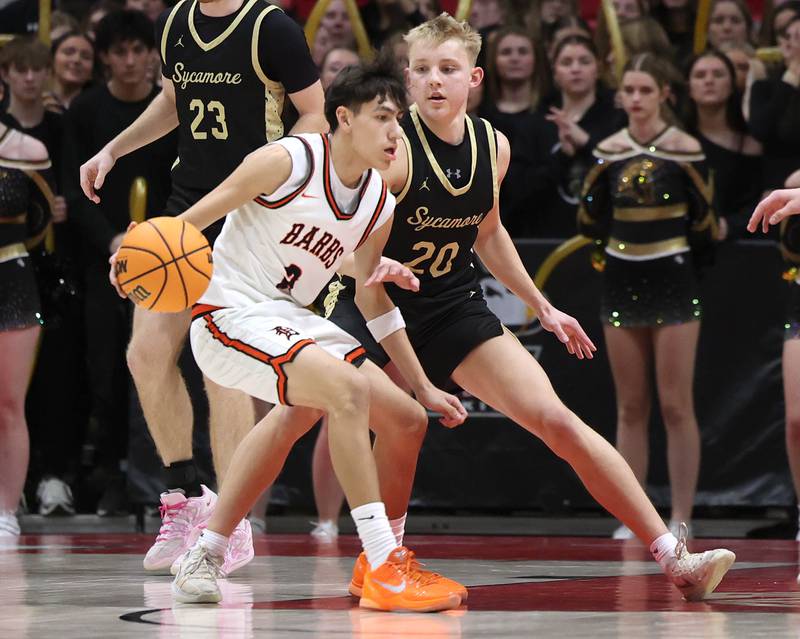 Sycamore's Isaiah Feuerbach plays defense against DeKalb's Aaron Ziga Friday, Jan. 30, 2026, during the FNBO Challenge at the Convocation Center at Northern Illinois University in DeKalb.