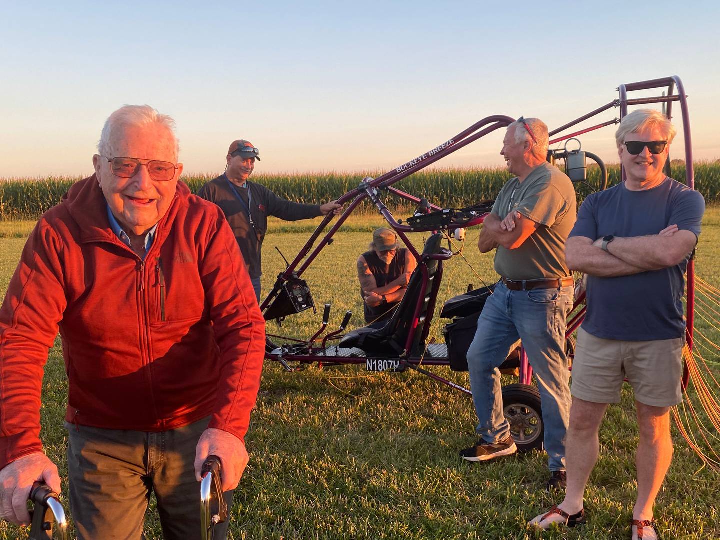 Willard Simpson (left) is all smiles after he disembarks from an ultralight aircraft Monday near Ashton. Simpson took flight as a passenger in the aircraft to celebrate his 100th birthday.