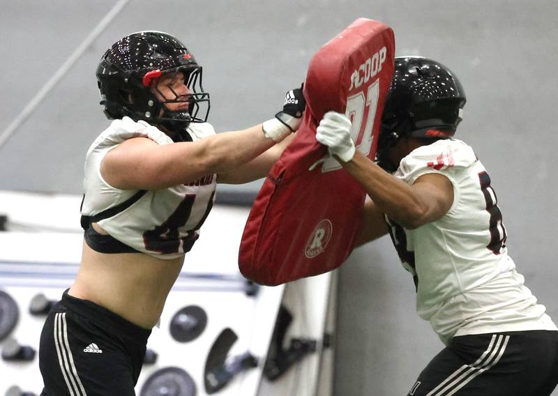 Northern Illinois University linebacker Christian Fuhrman (left) works with defensive end Jay'shon Thomas during a drill Wednesday, July 31, 2024, at practice in the Chessick Practice Center at NIU.