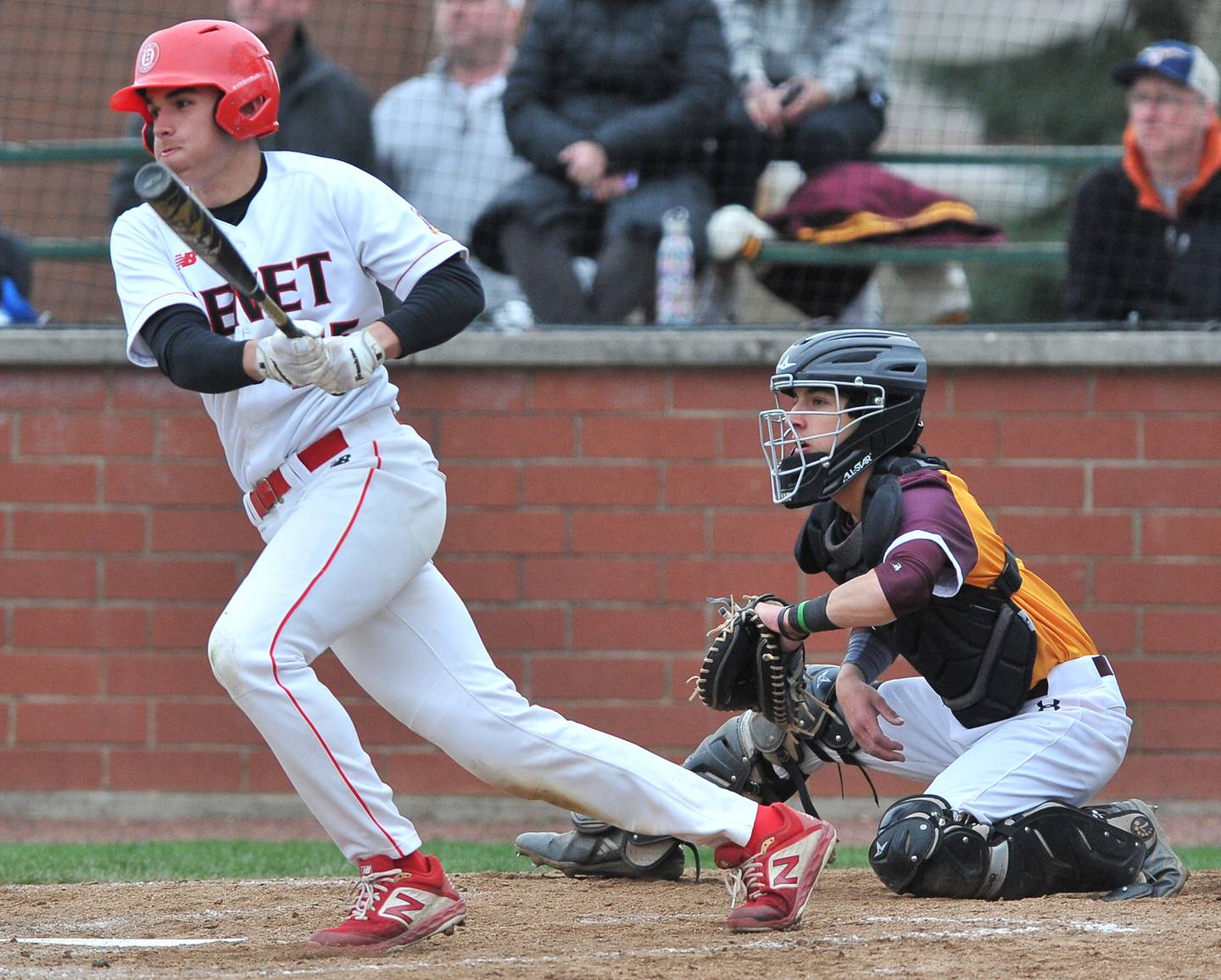Benet's Peter Messina smashes a base hit during a game  against Montini on Apr. 28, 2022 at Benet Academy in Lisle.