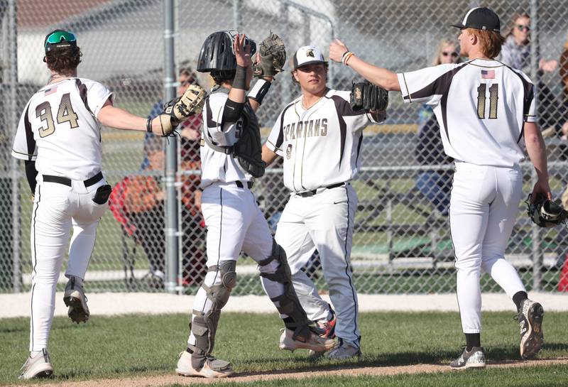 Sycamore's Teague Hallahan (right) gets congratulations as he comes off the field after pitching a good inning during their game against Kaneland Thursday, April 25, 2024, at the Sycamore Community Sports Complex.