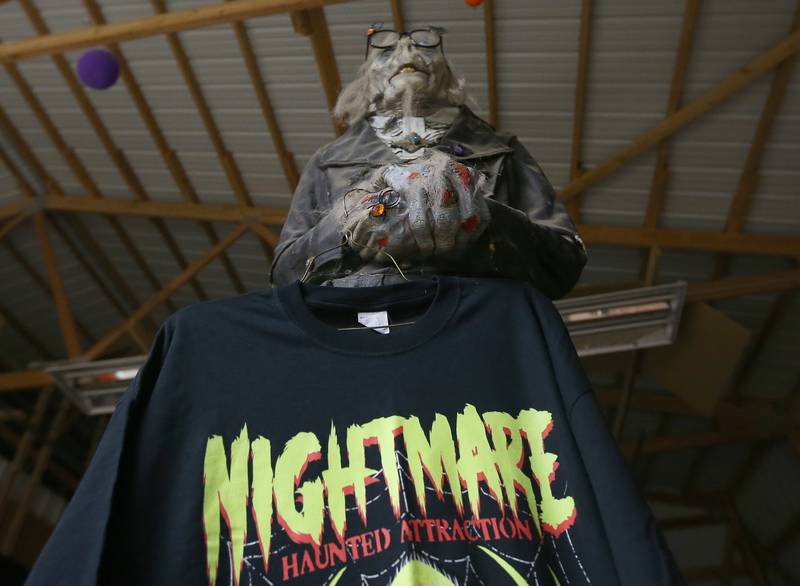 A character holds a Nightmare Haunted Attraction shirt on Saturday, Oct. 14, 2023 at the Bureau County Fairgrounds in Princeton. The event runs from 7 to 10 p.m. on Fridays and Saturdays through October 28. Admission is $15 per person.