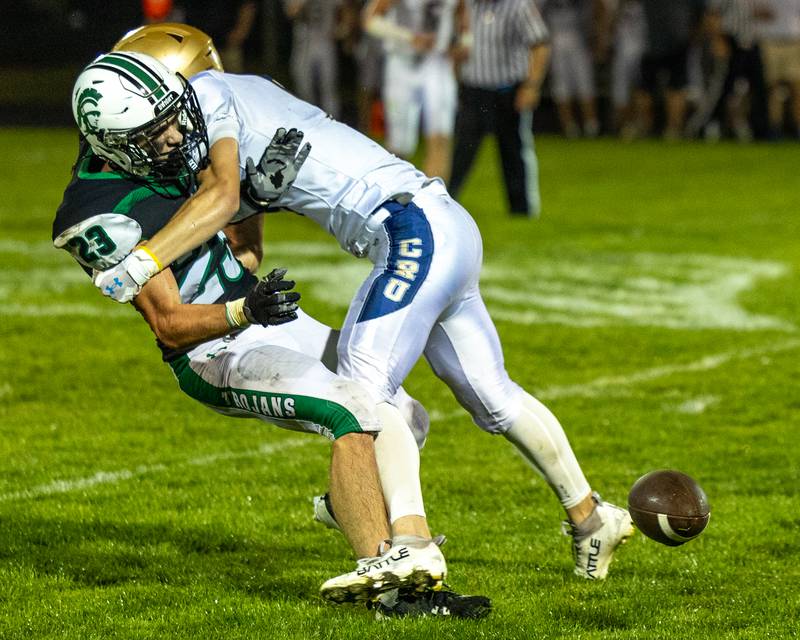 Landon Koger (23) of Dwight loses ball after being tackled by Easton Debernardi (13) of Marquette on Friday, Sept. 19, 2025 at Dwight High School in Dwight.