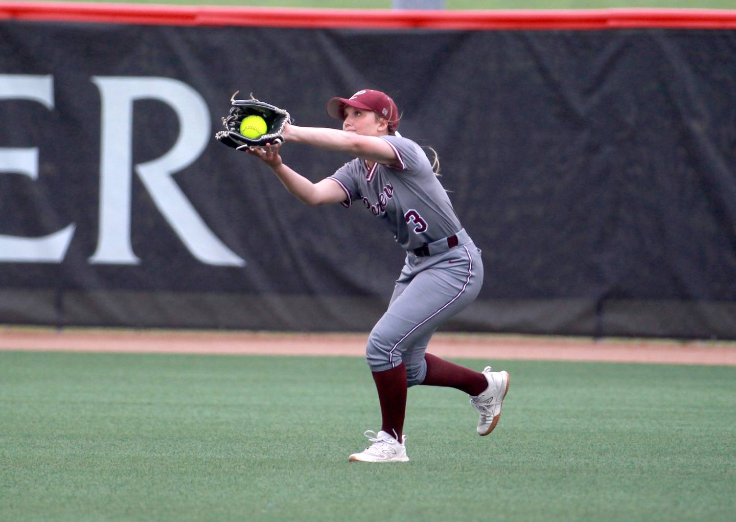 Lockport's Marcy Curry makes a catch in the outfield during a IHSA Class 4A state semifinal game against Barrington on Friday, June 13, 2025 at the Louisville Slugger Sports Complex in Peoria.