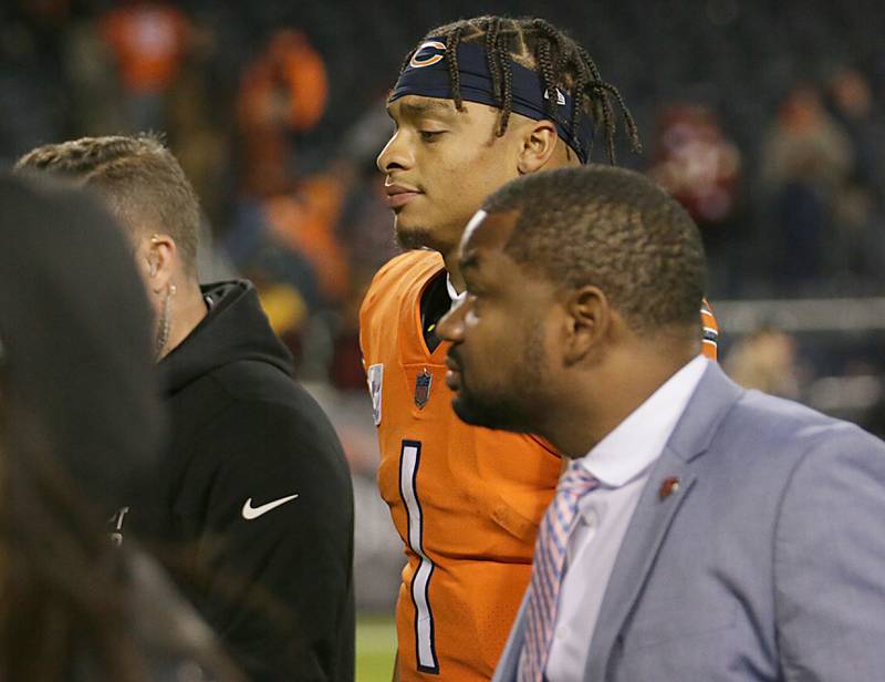 Chicago Bears quarterback Justin Fields walks off the field against the Washington Commanders on Thursday, Oct. 13, 2022 at Soldier Field.